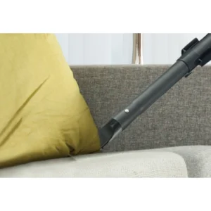 Original Hitachi Crevice Cleaning Attachment in Use – The vacuum cleaner using a crevice tool to clean tight spaces, like couch gaps and corners.